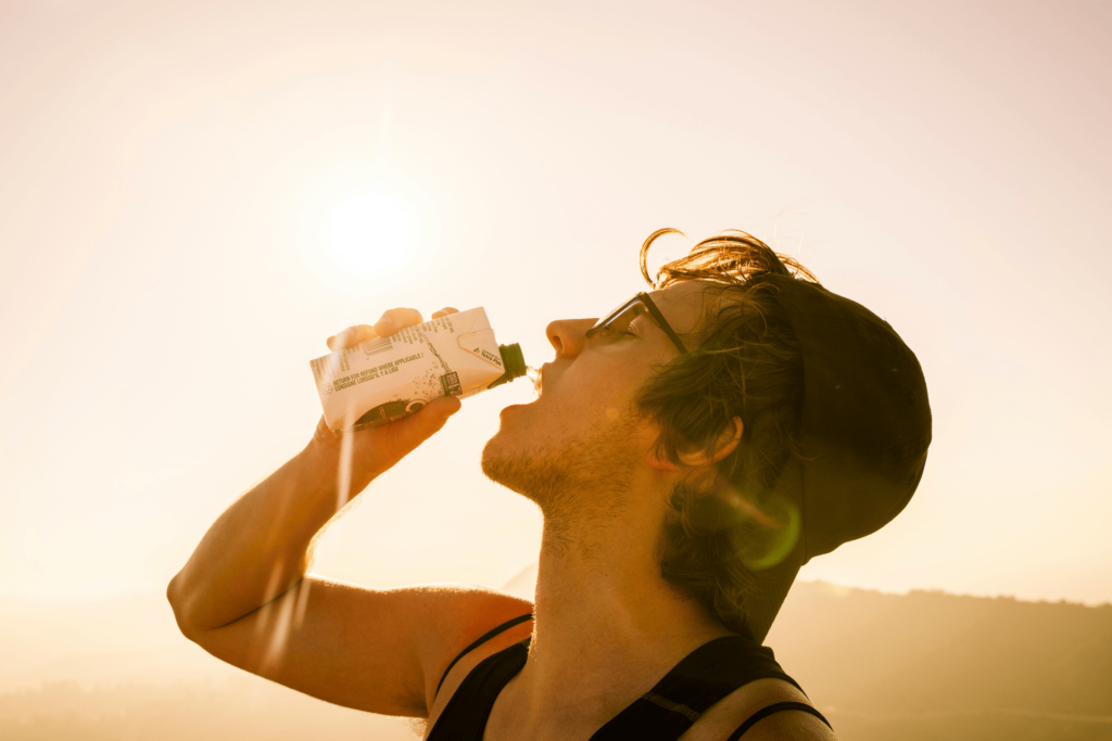 man chugging water - common hydration mistakes