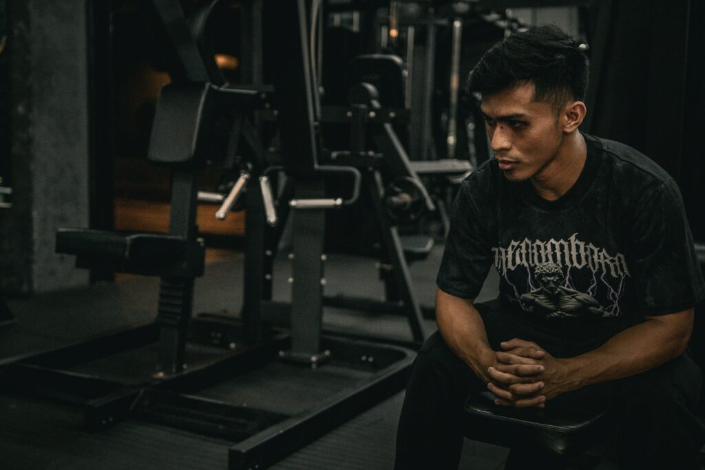 Man deciding to go for home vs gym workout