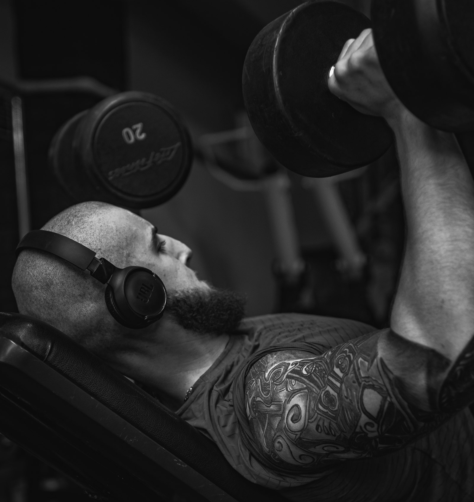 Man doing a dumbbell bench press