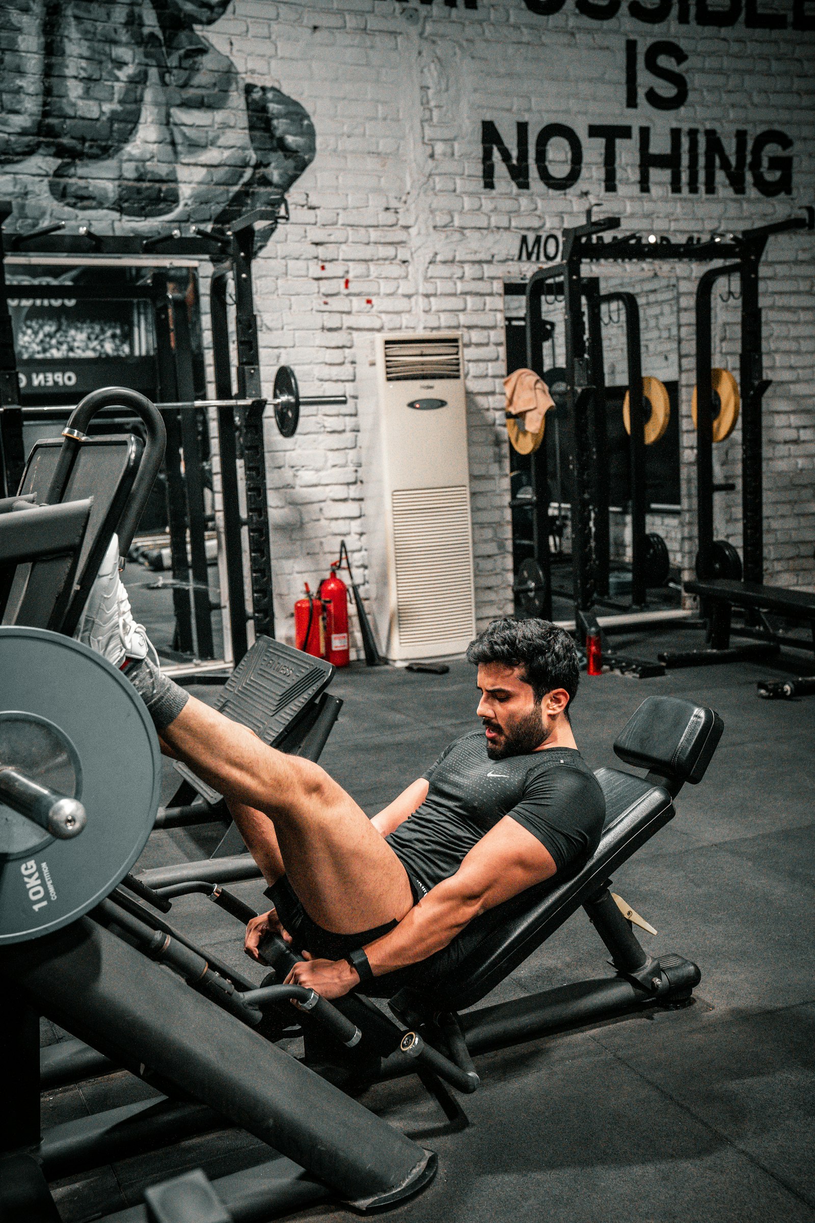 Man training on a leg press machine